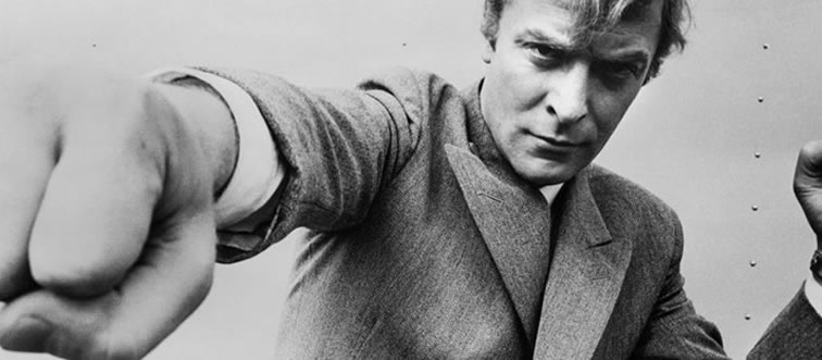 Lock in the clue: which British cinema giant is famous for his signature cockney accent and massive box office draw?