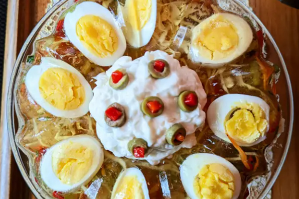 Blink and think — which vintage '40s and '50s "salad" trapped shredded cabbage, celery, and bell peppers inside a mold of savory, seasoned gelatin?