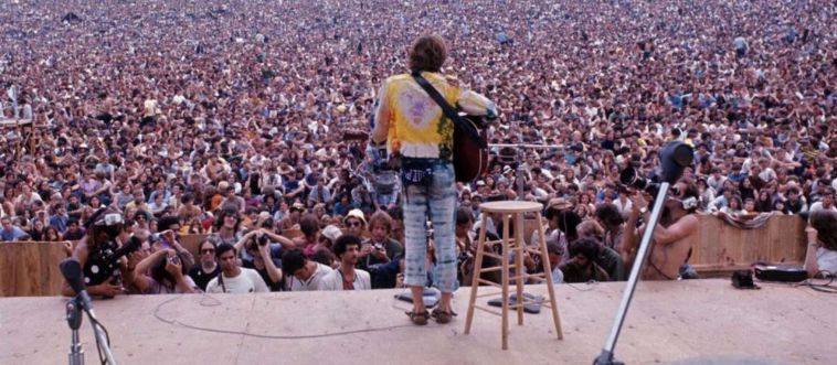 Can you place the legendary 1969 music gathering on a New York dairy farm that came to represent the ultimate era of peace, love, and rock 'n' roll?