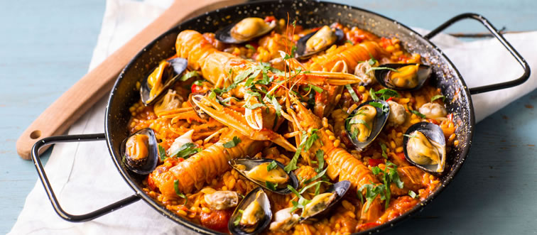 First instinct: which nation gave the culinary world the vibrant rice dish known as "Paella"?