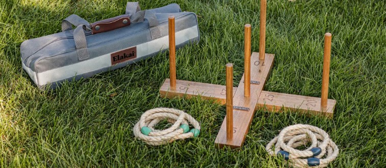 First instinct: which classic pastime has you throwing loops to hook them onto a central peg?