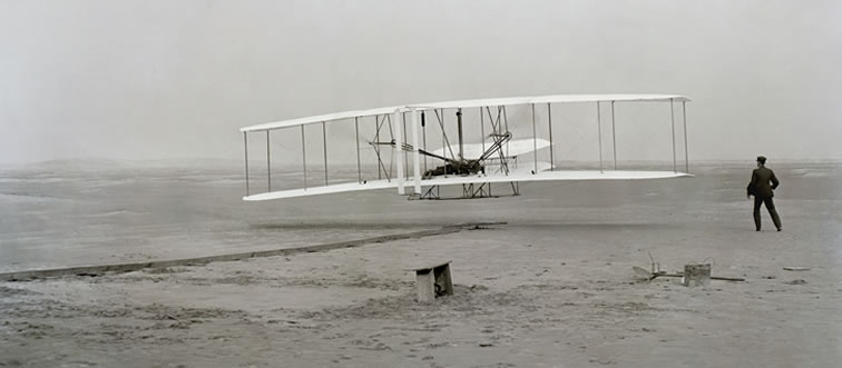 Lock in the clue: which sibling duo successfully launched the first powered airplane back in 1903?