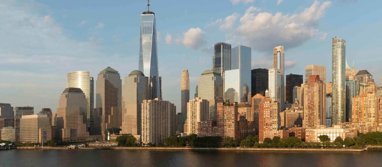 First instinct: which city's horizon is dominated by the 541-meter spire of One World Trade Center?