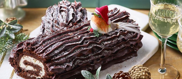 Lock in the clue: which French holiday cake mimics a rustic woodland log, complete with edible mushrooms and chocolate bark?