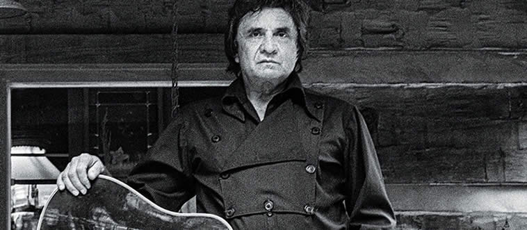 Can you name the iconic "Man in Black" who made music history with raw, live recordings inside Folsom Prison and San Quentin?