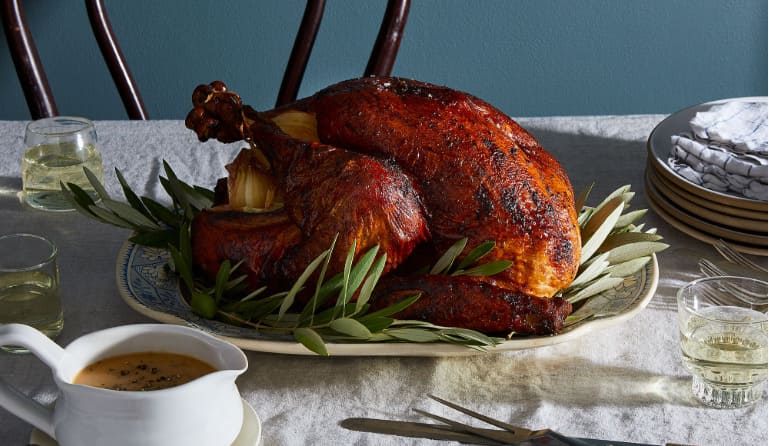 Quick — which tart red fruit gets cooked down into the classic sweet-and-sour sauce served alongside the holiday turkey?