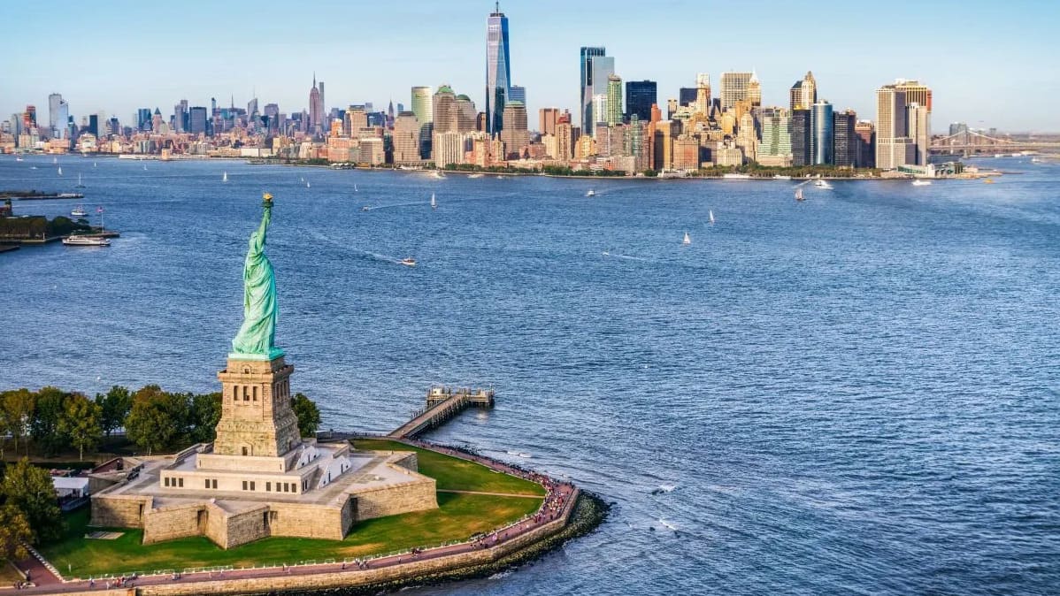 Can you name the legendary monument in New York Harbor that welcomed generations of immigrants?
