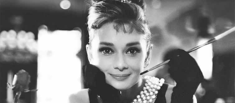 Lock in the clue: which cinema legend made the "Little Black Dress" famous in Breakfast at Tiffany's?