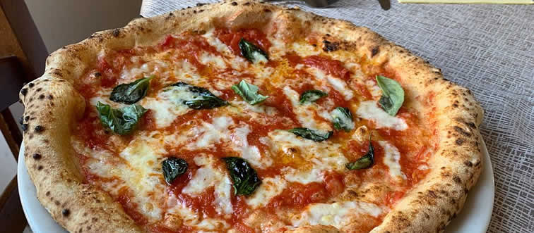 Blink and think — which country gave the world the legendary, cheese-topped culinary masterpiece known as pizza?