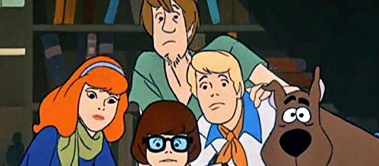 Blink and think — which legendary cartoon introduced us to the cowardly, mystery-solving talking Great Dane named Scooby?